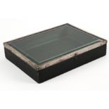 A SILVER MOUNTED GLASS DISPLAY BOX