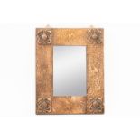 AN ART NOVEAU COPPER FRAMED REPOUSSÉ WALL MIRROR