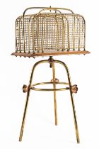 AN EDWARDIAN BRASS AND COPPER MOUNTED OAK CANTERBURY OR MAGAZINE RACK