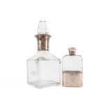 A SILVER MOUNTED GLASS SPIRIT FLASK AND A EUROPEAN SPIRIT DECANTER (2)