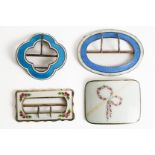 FOUR SILVER AND ENAMELLED BUCKLES (4)