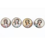 A SET OF FOUR MINATURE BUTTONS (4)