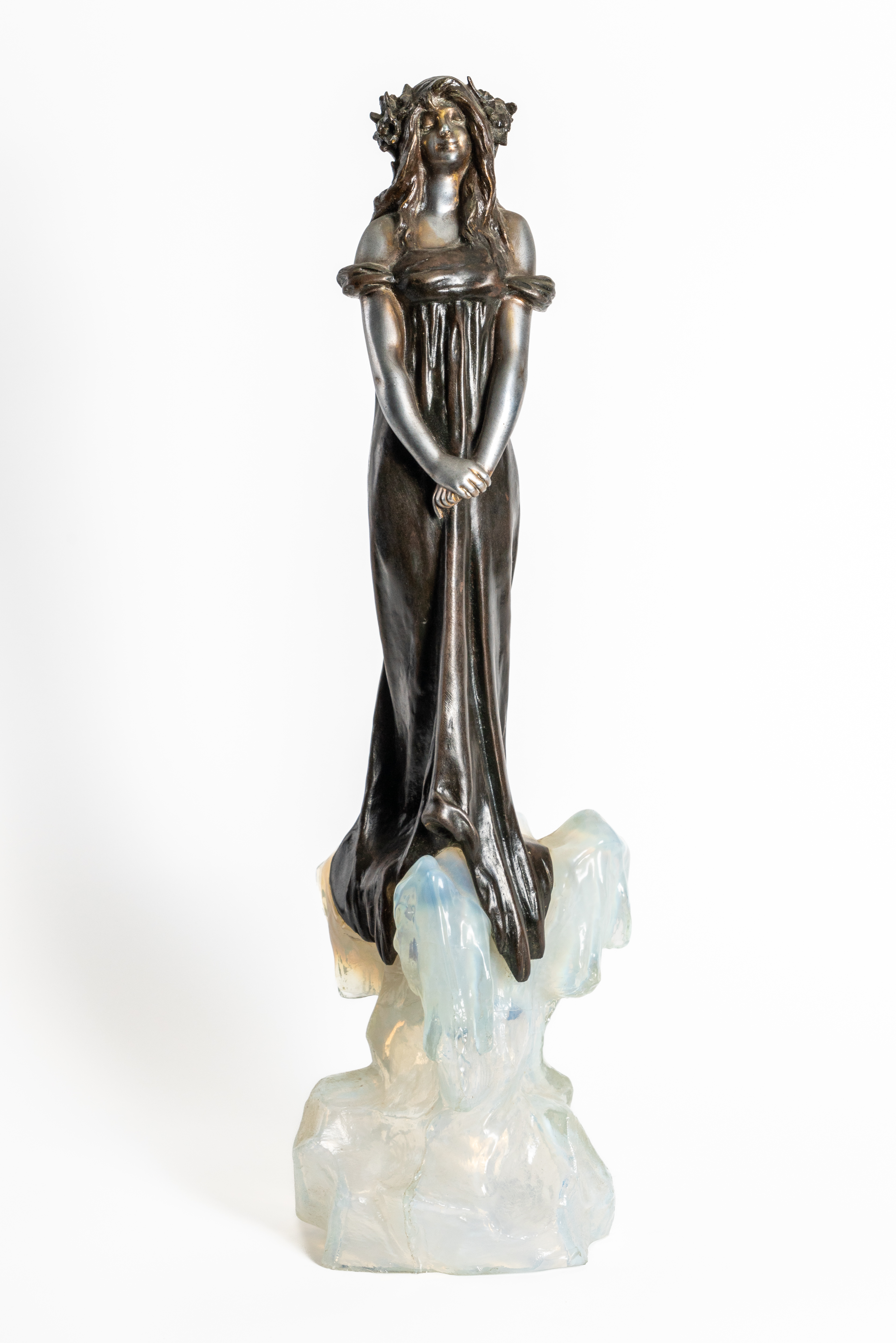 JULIEN CAUSSE (FRENCH 1869-1914): AN ART NOUVEAU SILVERED AND PATINATED BRONZED SPELTER FIGURE...