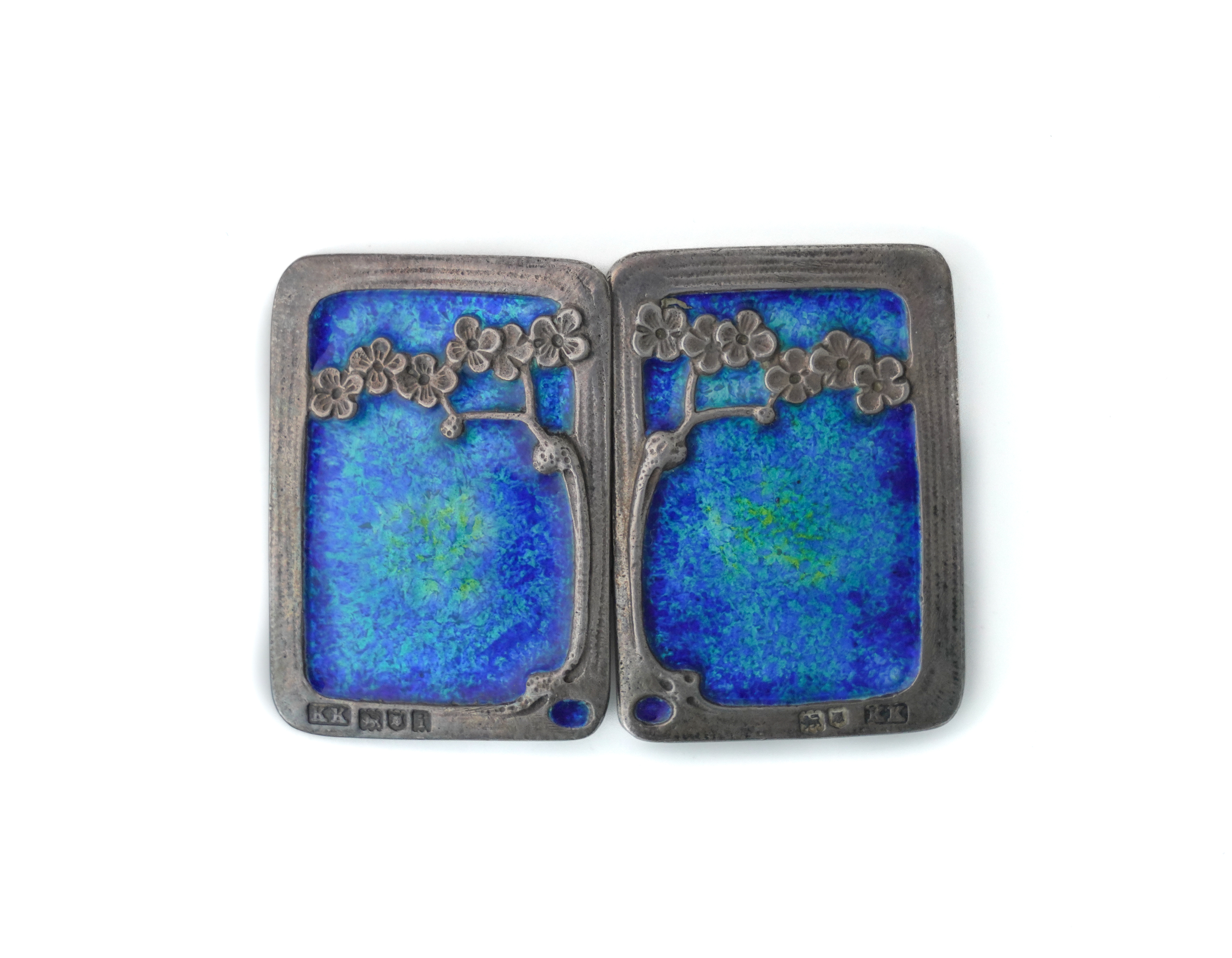 A SILVER AND ENAMELLED TWO PIECE RECTANGULAR WAISTBELT BUCKLE