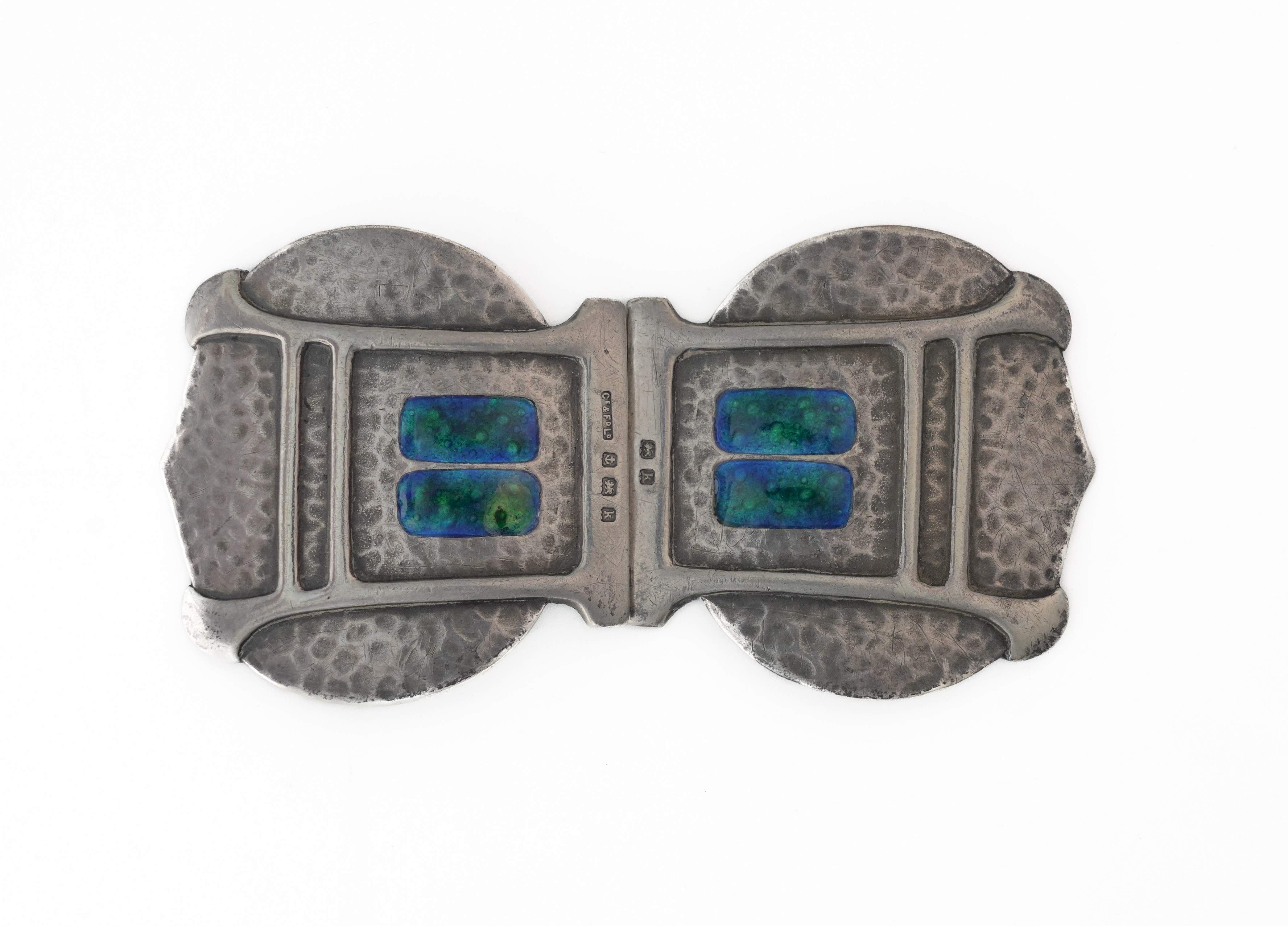 A SILVER AND ENAMELLED TWO PIECE WAISTBELT BUCKLE