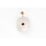 AN EARLY 20TH CENTURY ROCK CRYSTAL AND RUBY EGG CHARM