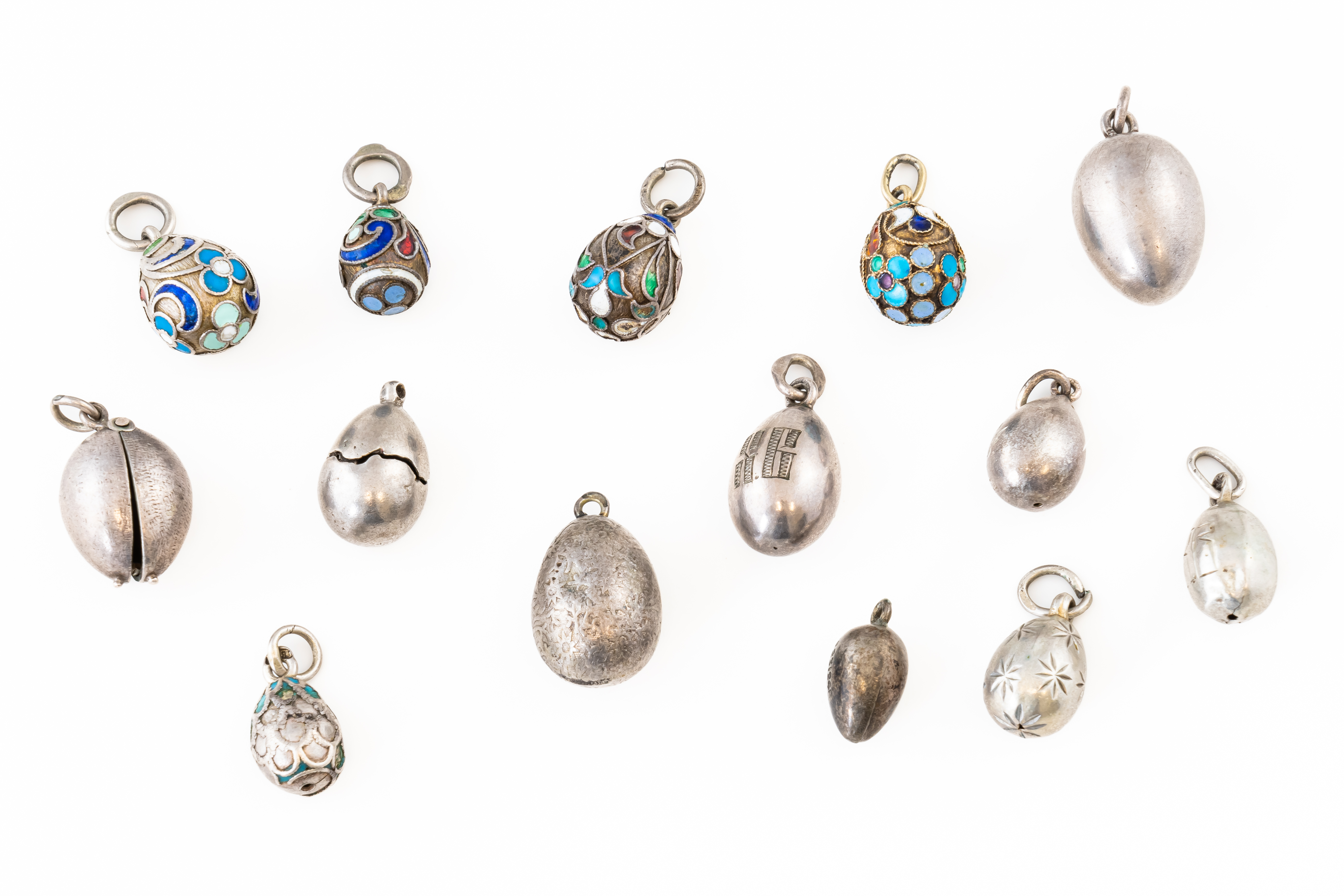 A GROUP OF MOSTLY RUSSIAN SILVER EGG CHARMS (13)