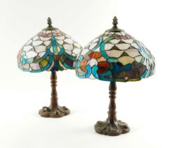 A PAIR OF TIFFANY STYLE STAINED AND LEADED GLASS MOUNTED TABLE LAMPS (2)