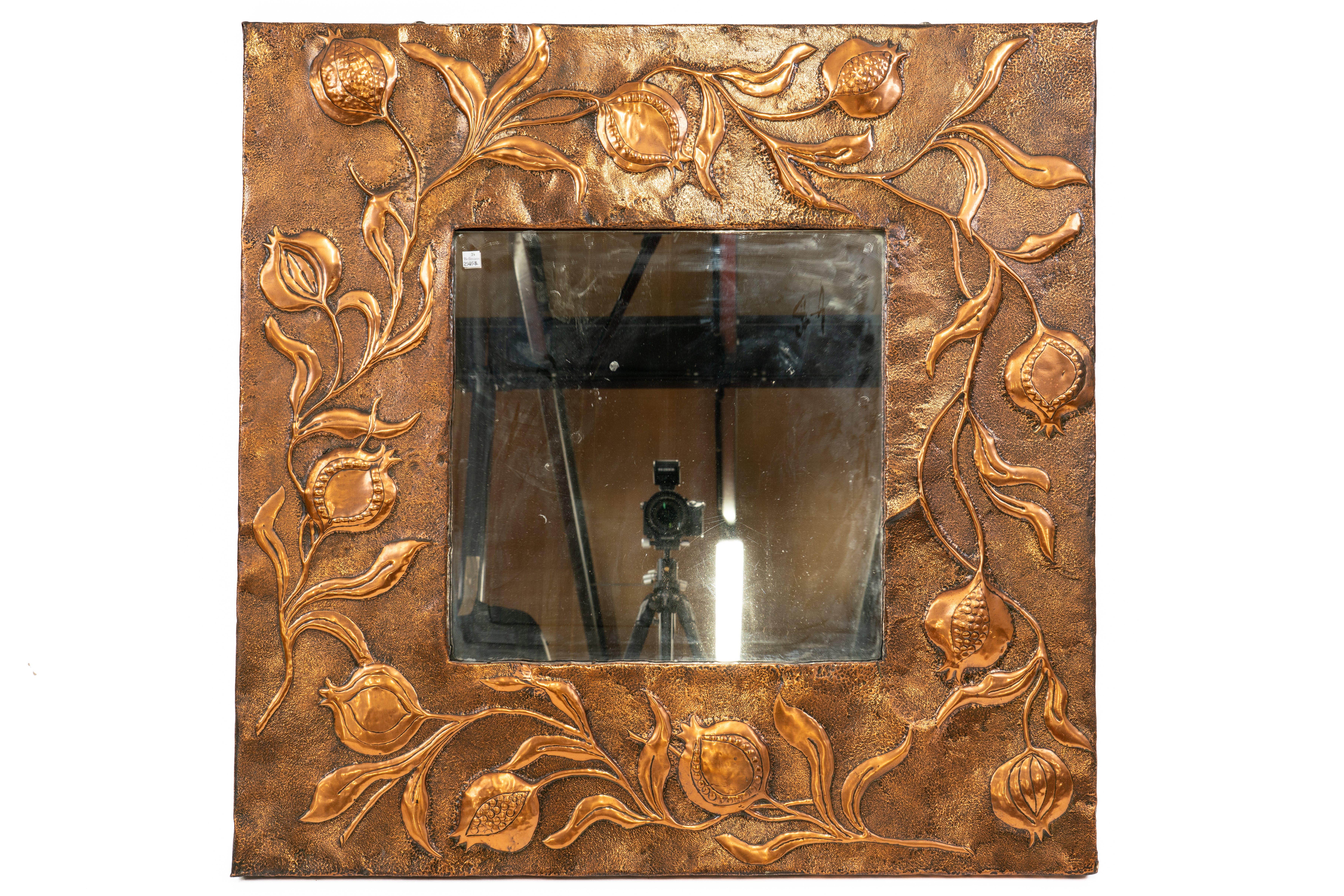 IN THE MANNER OF LIBERTY & CO; AN ARTS & CRAFTS COPPER SQUARE REPOUSSÉ WALL MIRROR - Image 2 of 13