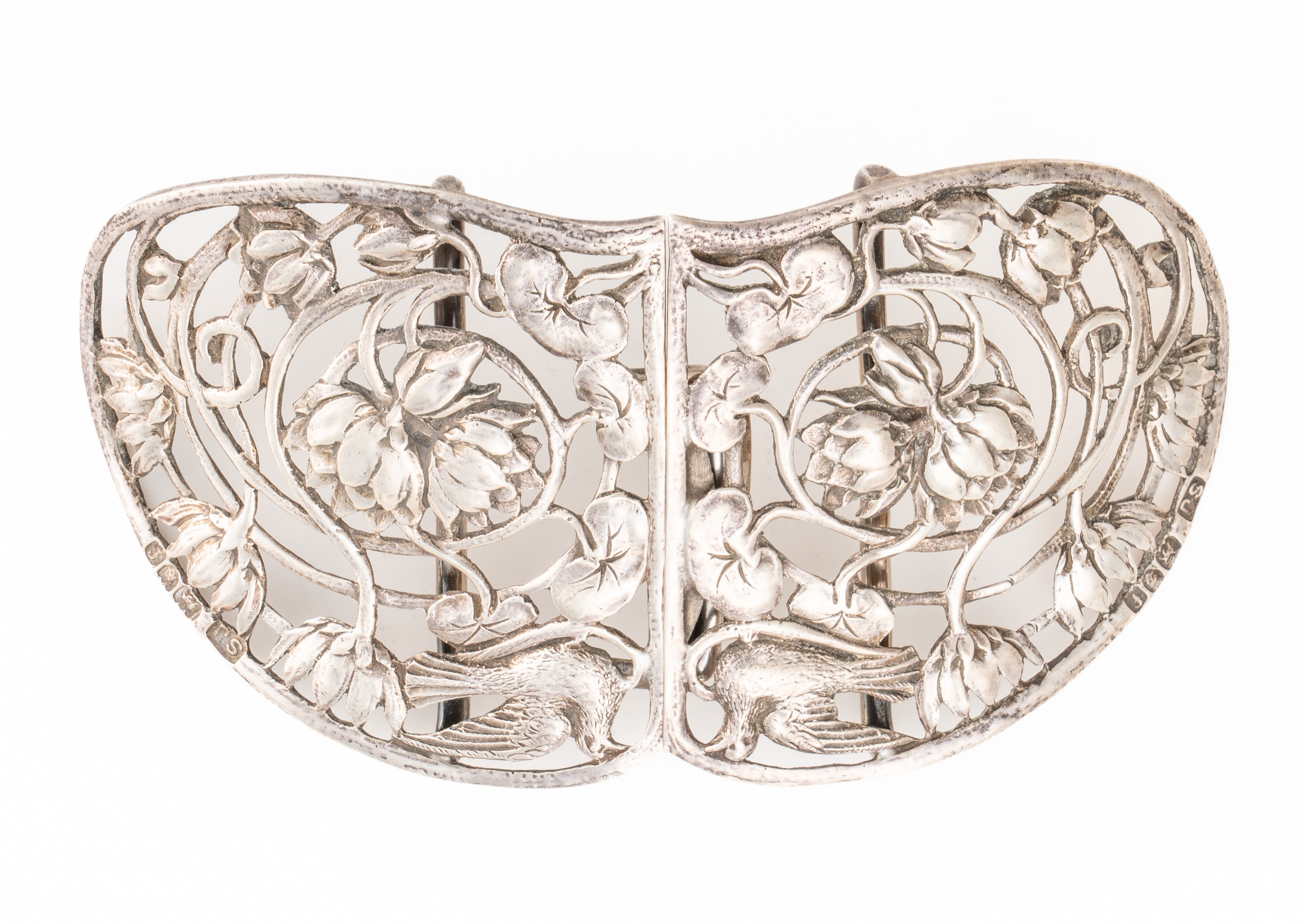 A SILVER TWO PIECE WAISTBELT BUCKLE