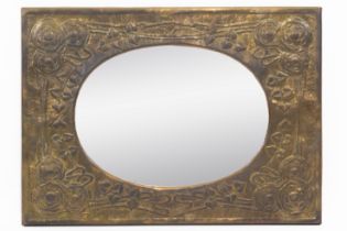IN THE MANNER OF LIBERTY & CO; AN ARTS & CRAFTS COPPER FRAMED REPOUSSÉ WALL MIRROR