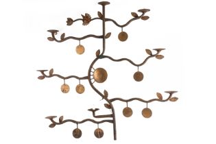 A WROUGHT IRON EIGHT LIGHT TREE SHAPED WALL MOUNTED CANDELABRUM