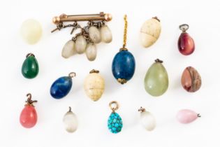 A GROUP OF EGG CHARMS (QTY)