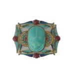 PIEL FRERES; A GILT METAL ENAMELLED AND CERAMIC WAISTBELT BUCKLE