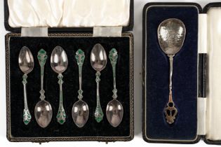 A SET OF SIX SILVER AND GREEN ENAMELLED COFFEE SPOONS AND ANOTHER SPOON (7)