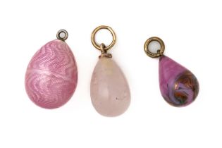 A GROUP OF THREE PINK EGG CHARMS (3)