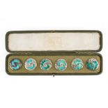 A MATCHED SET OF SIX LIBERTY AND CO SILVER AND ENAMELLED BUTTONS (6)