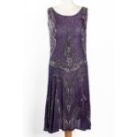 AN ART DECO PURPLE CHIFFON AND BEADED FLAPPER DRESS