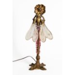 AN ART NOUVEAU GILT-BRASS AND FROSTED GLASS TABLE LAMP IN THE FORM OF A DRAGONFLY AND FLOWER