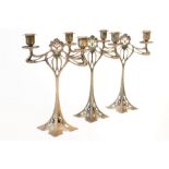 A GARNITURE OF THREE W.M.F PLATED TWIN LIGHT TABLE CANDELABRA (3)