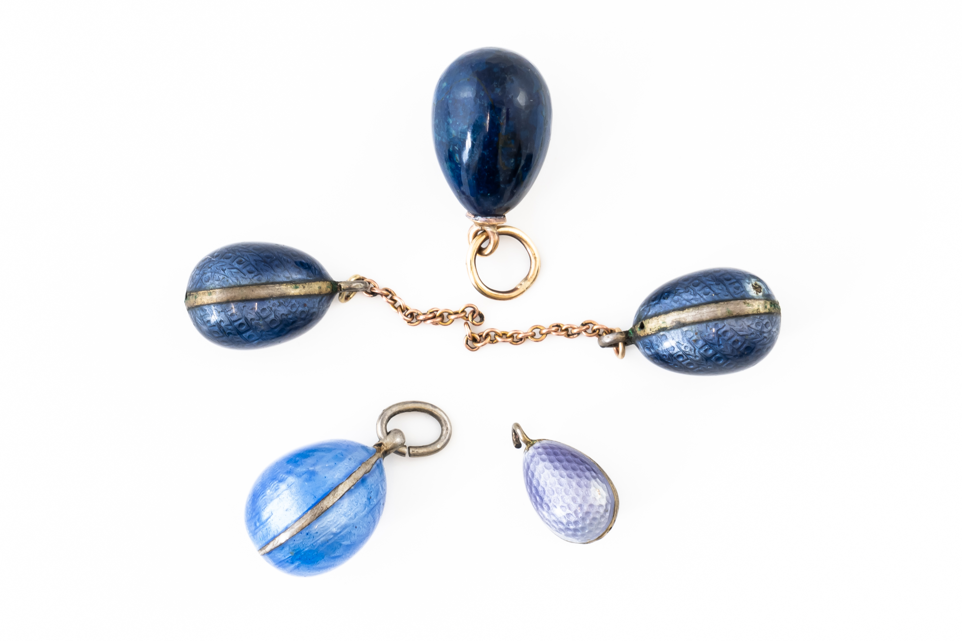 A GROUP OF FIVE BLUE EGG CHARMS (5)