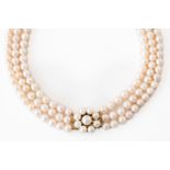 A THREE-ROW CULTURED PEARL NECKLACE