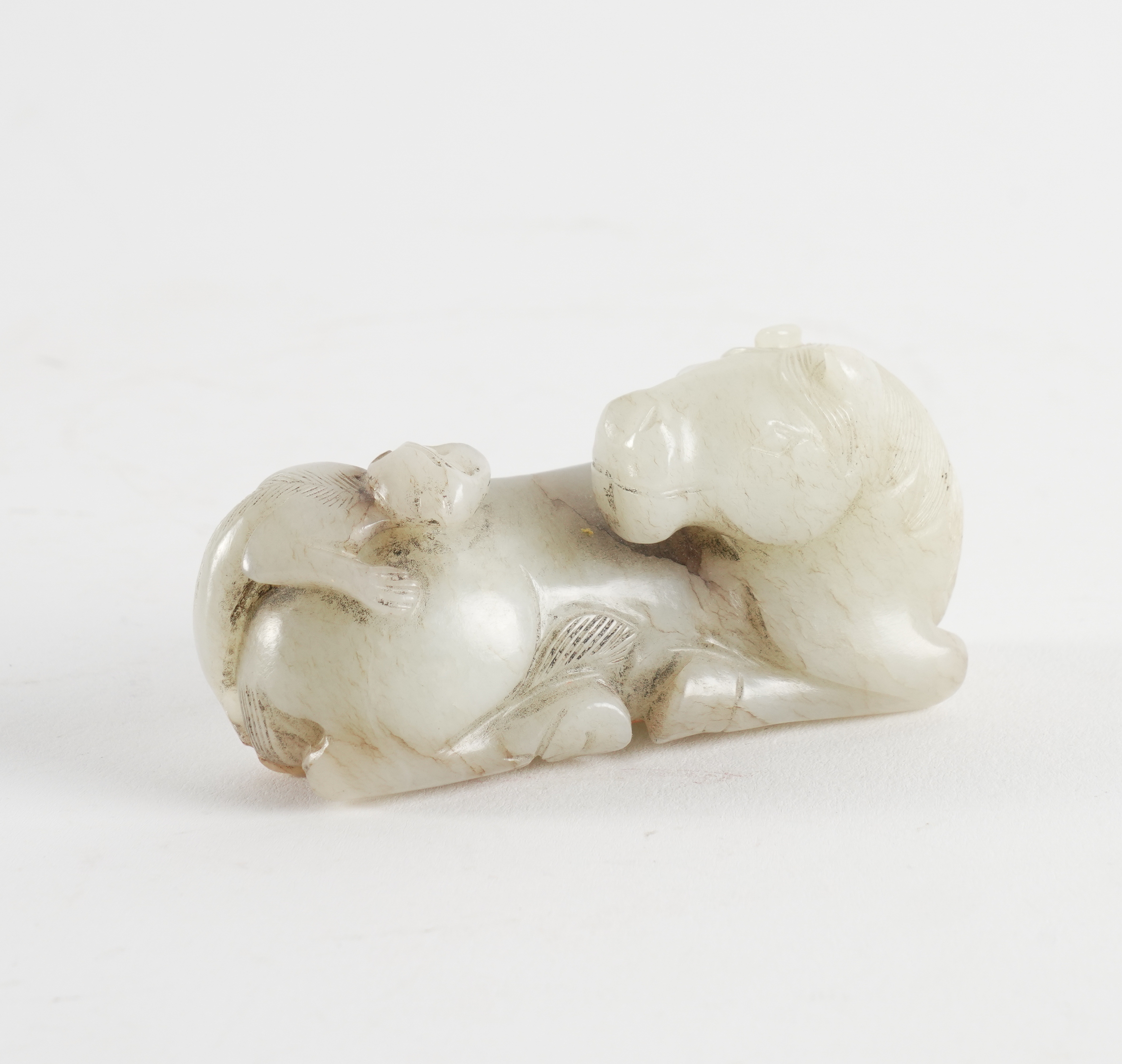 A CHINESE MING STYLE JADE `HORSE AND MONKEY GROUP'