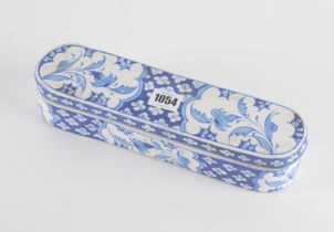 AN IZNIK POTTERY BLUE AND WHITE PEN BOX AND COVER (2)