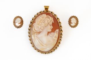 A 9CT GOLD MOUNTED OVAL SHELL CAMEO PENDANT BROOCH AND A PAIR OF EARSTUDS (3)