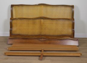 A FRENCH WALNUT AND CANE KING SIZE BED