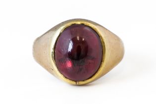 A GARNET SIGNET RING