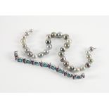 A GREY TINTED CULTURED PEARL NECKLACE AND AN AMETHYST AND BLUE TOPAZ BRACELET (2)