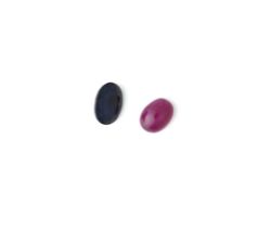 AN UNMOUNTED CABOCHON RUBY AND AN UNMOUNTED OVAL CUT SAPPHIRE (3)