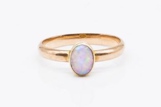 A GOLD AND OPAL SINGLE STONE RING