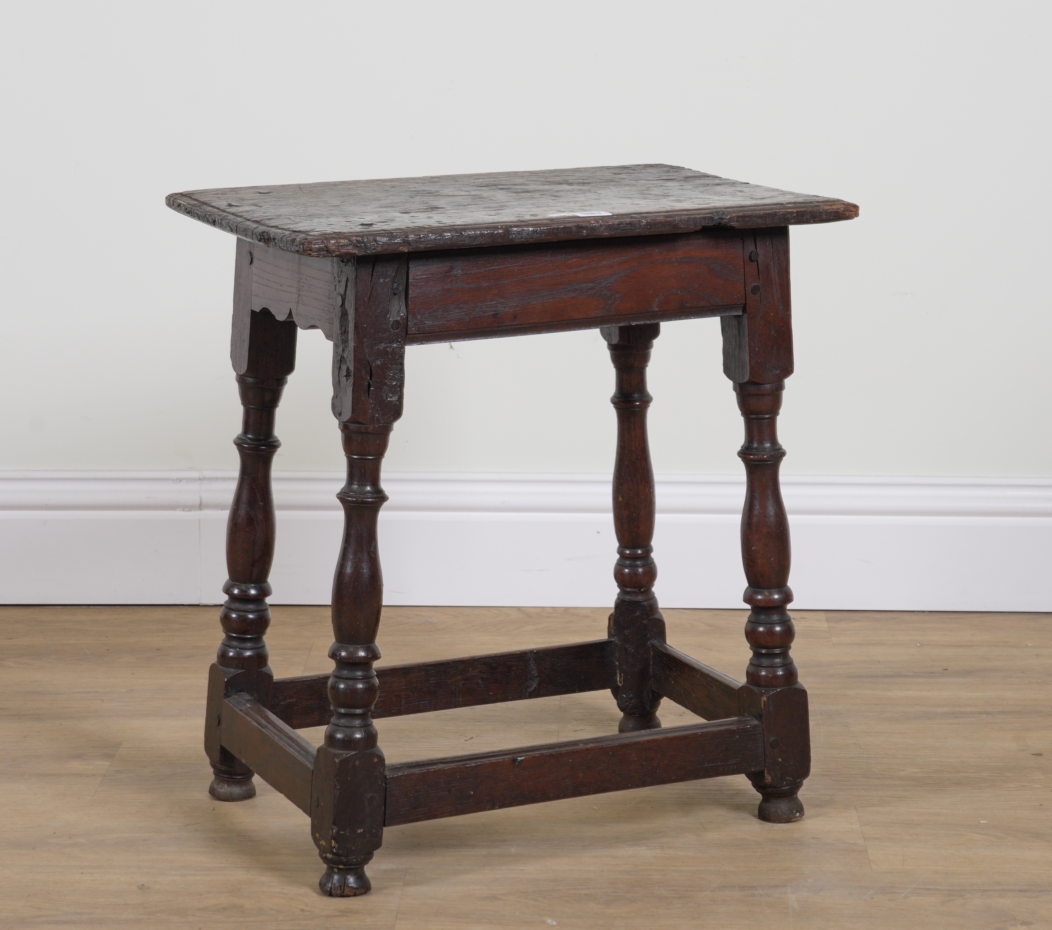 A 17TH CENTURY AND LATER OAK JOINT STOOL