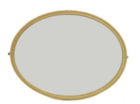 A CREAM PAINTED OVAL WALL MIRROR (2)