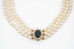 A THREE ROW NECKLACE OF UNIFORM CULTURED PEARLS