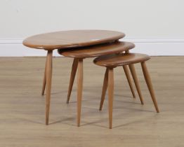 ERCOL PEBBLE DESIGN; A NEST OF THREE ELM AND BEECH COFFEE TABLES