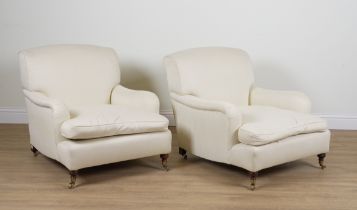 A PAIR OF HOWARD STYLE UPHOLSTERED ARMCHAIRS (2)