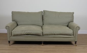 GEORGE SMITH; A GREEN UPHOLSTERED THREE SEATER SOFA