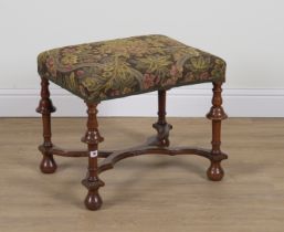 A WILLIAM AND MARY STYLE WALNUT RECTANGULAR FOOTSTOOL WITH SHAPED X FRAME STRETCHER