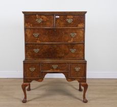 A MID 18TH CENTURY AND LATER FIGURED WALNUT FOUR DRAWER CHEST ON STAND