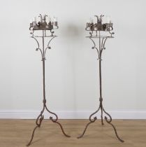 A PAIR OF GOTHIC REVIVAL POLISHED STEEL FLOOR STANDING CANDELABRA (2)