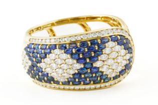 AN 18CT YELLOW GOLD, SAPPHIRE AND DIAMOND SPRUNG HINGED BANGLE