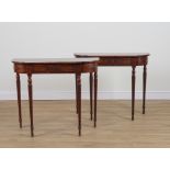 A PAIR OF MAHOGANY BOW FRONT SINGLE DRAWER CONSOLE TABLES (2)