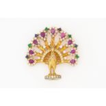 A YELLOW GOLD AND VARICOLOURED GEMSTONE PEACOCK BROOCH