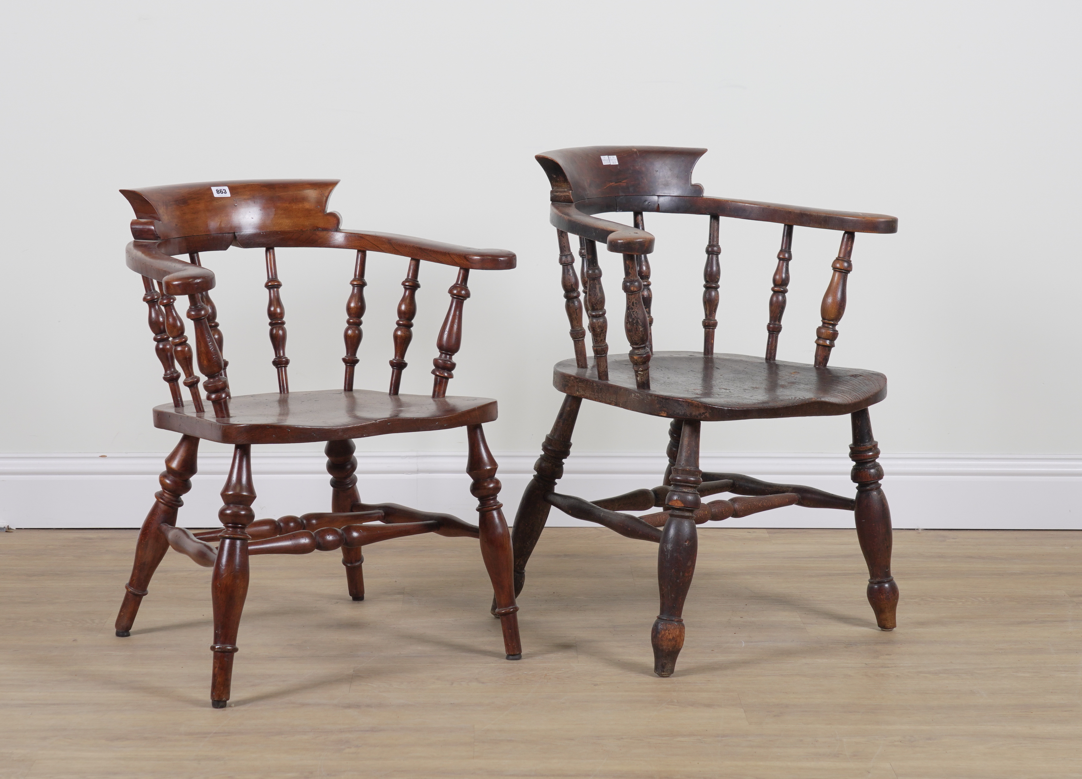 A NEAR PAIR OF ELM SEATED SMOKER'S BOW ARMCHAIRS (2)