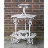 A VICTORIAN WHITE PAINTED CAST IRON FOUR TIER PLANT STAND
