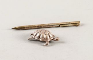 A TIFFANY AND CO SILVER MODEL OF A TORTOISE AND A TIFFANY AND CO SILVER CASED PROPELLING...