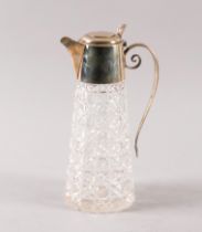 A SILVER MOUNTED FACETED GLASS CLARET JUG